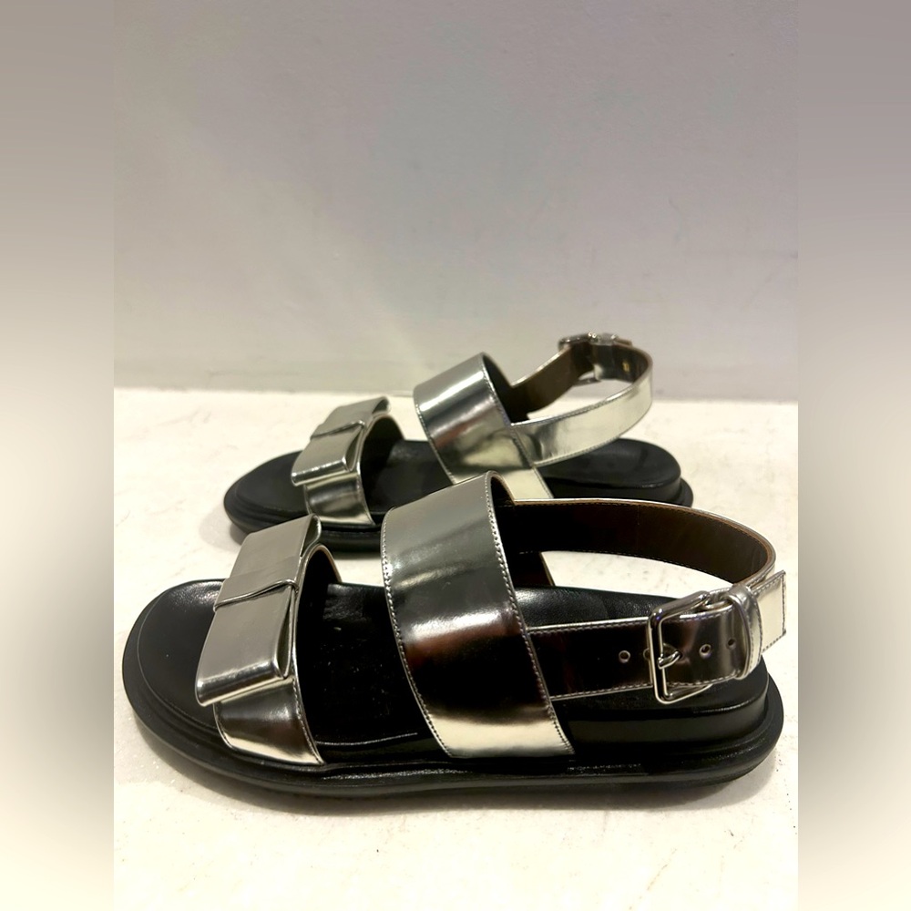 New in box MARNI silver leather bow front buckle sandals. Size 37/7. Never worn.